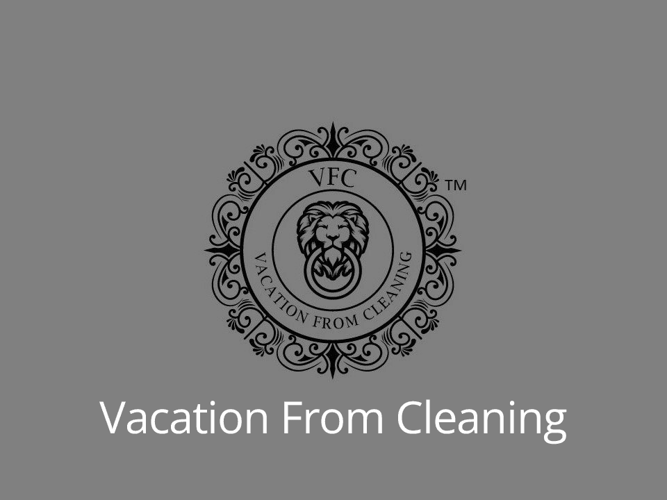 Black and white logo for "vacation from cleaning" with a lion motif enclosed in an ornate circle.